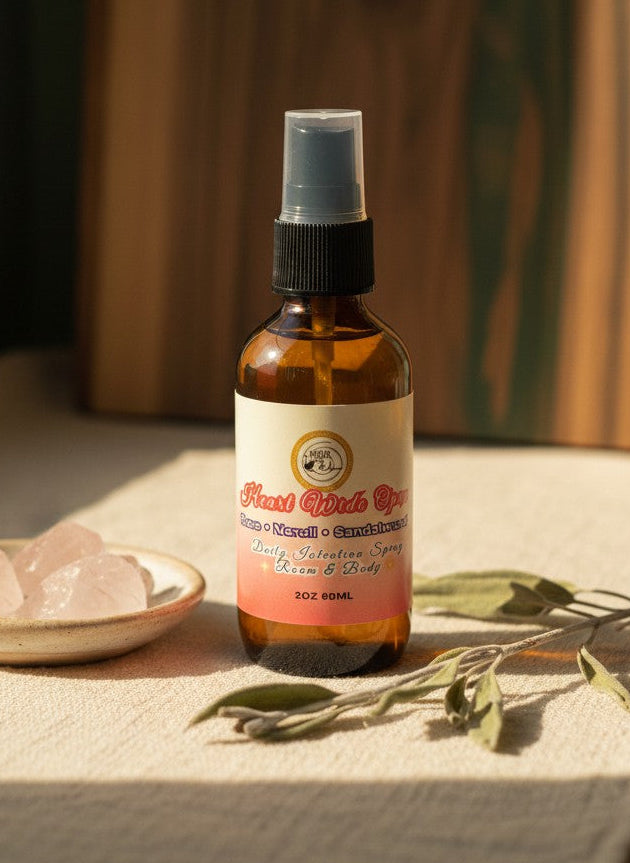 Heart Wide Open Daily Intention Spray, 2 oz, on a table with crystals and herbs