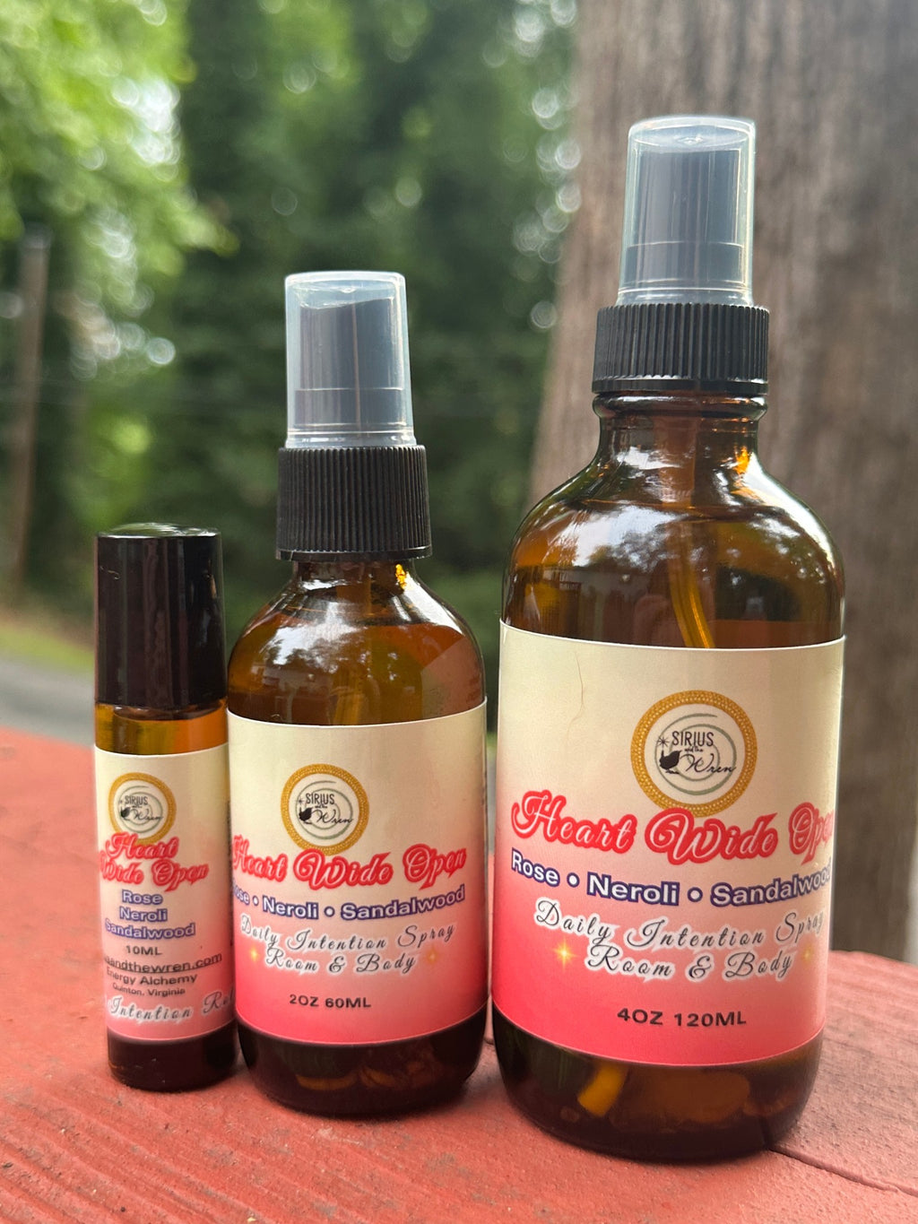Heart Wide Open products together on a wooden surface with a blurred natural background