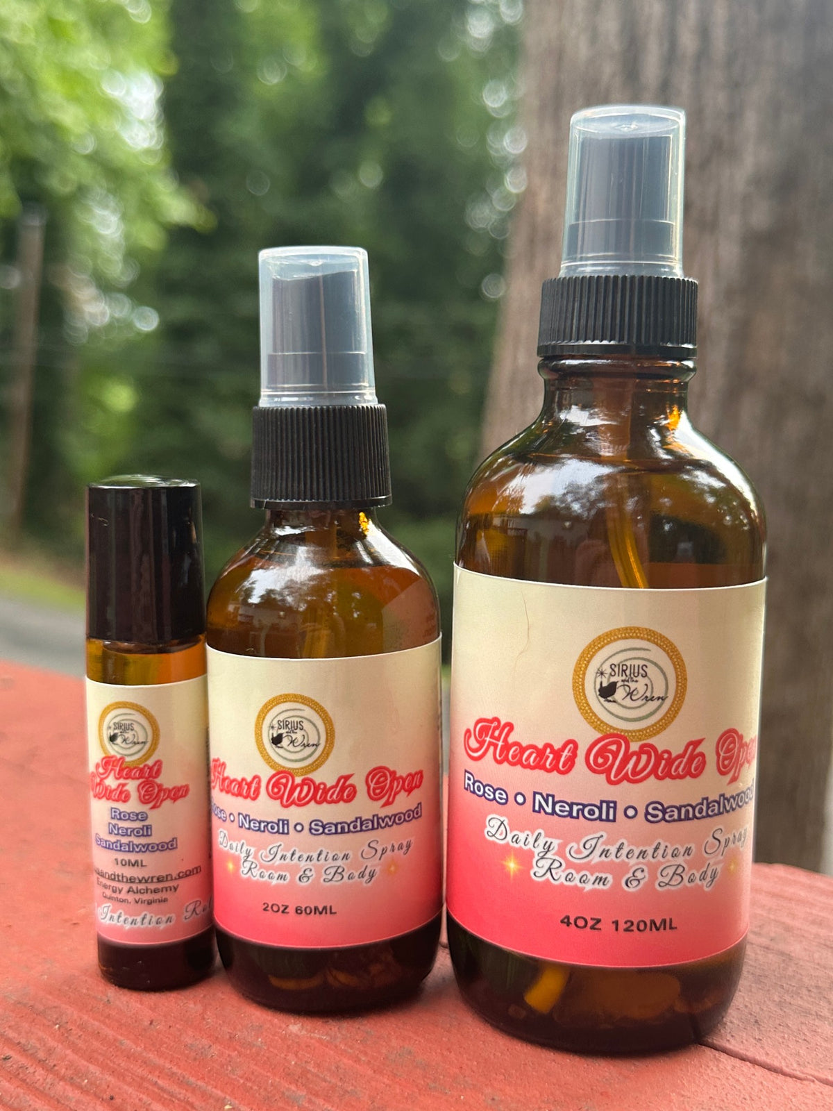 Heart Wide Open products together on a wooden surface with a blurred natural background